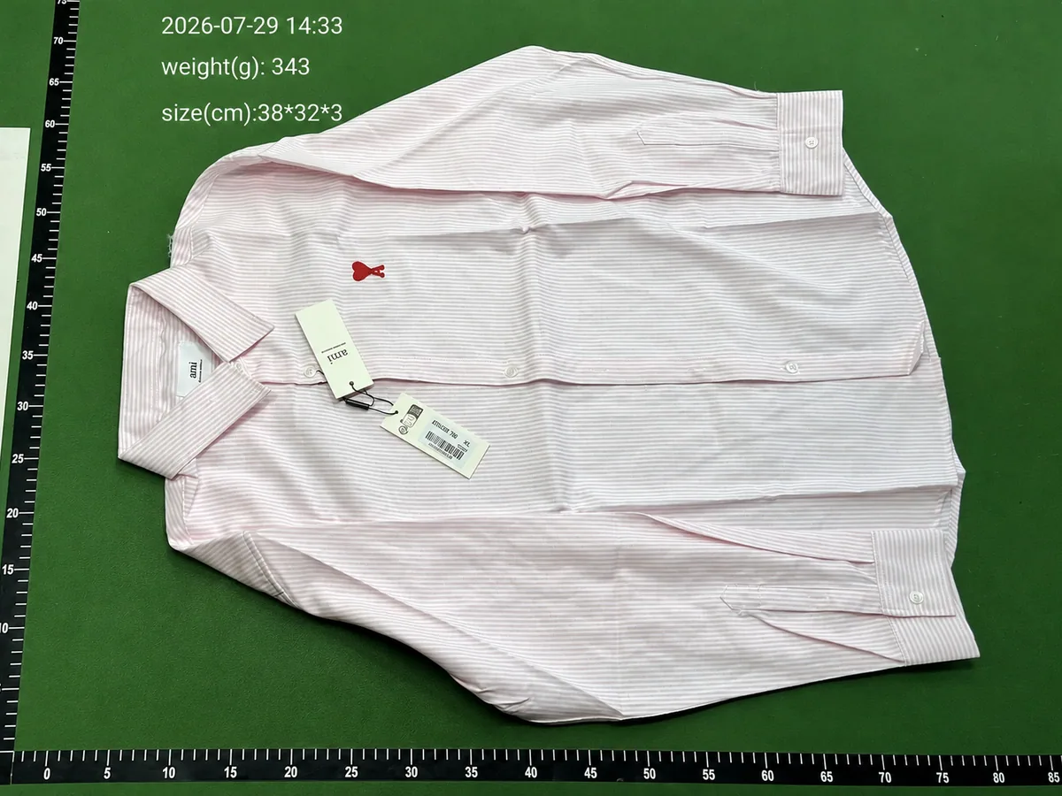 QC inspection photo of a striped shirt with labels, weight, dimensions and measurement scales